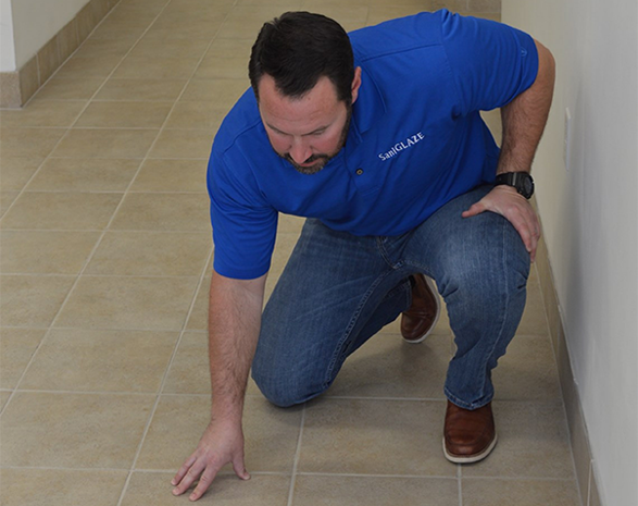 SaniGLAZE Employee Inspecting Floor